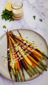 roasted carrots on a grey plate