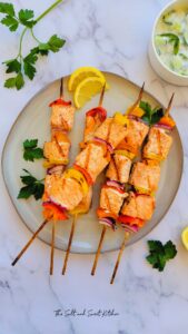 Salmon Kabobs are are what Summer grilling is all about. They’re healthy, easy to make Cooked and topped with a zesty lemon marinade, and packed with vibrant Mediterranean flavors!