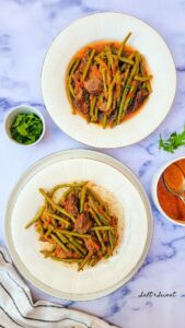 Lebanese Green Bean Stew is one of the many traditional Lebanese stews that you are going to LOVE! Perfectly spiced beef chunks with tender green beans, onions and garlic, all braised in a hearty tomato sauce. It's comfort food heaven!