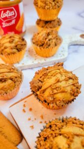 This Biscoff Muffins recipe results in moist, fluffy muffins. Made with speculoos cookie butter and topped with a quick biscoff streusel; the crushed biscoff cookies and the drizzling with more melted biscoff spread is optional, but definitely recommended!